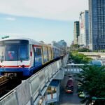 A BTS Skytrain on the elevated track above Bangkok traffic