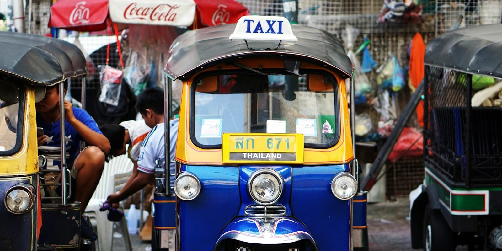 Colourful tuk-tuks parked on a Bangkok street