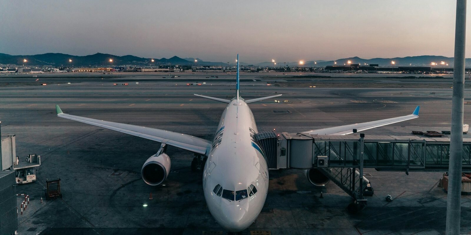 A plane parked at an airport gate