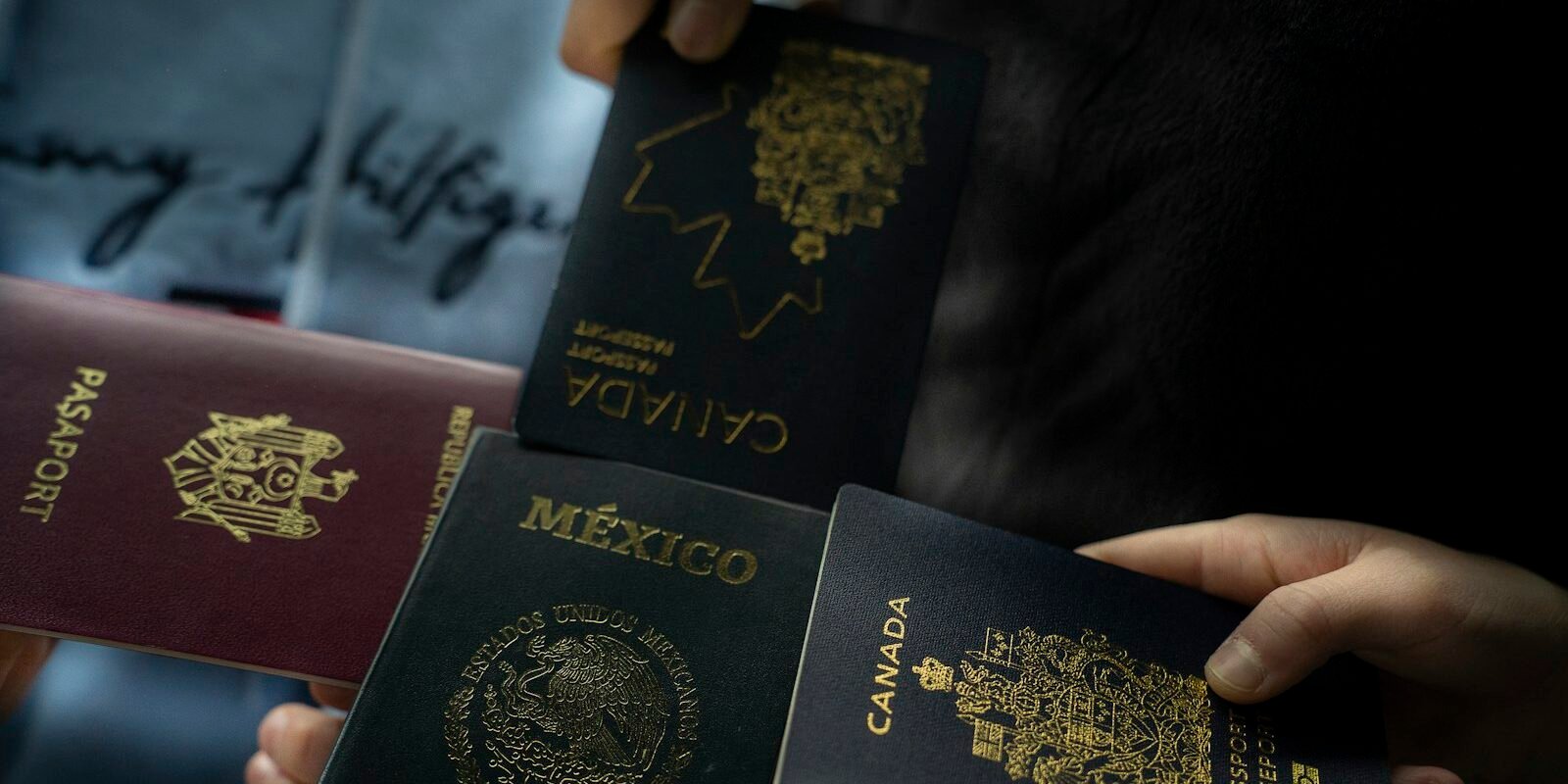 Mexican and foreign passports held by a traveller