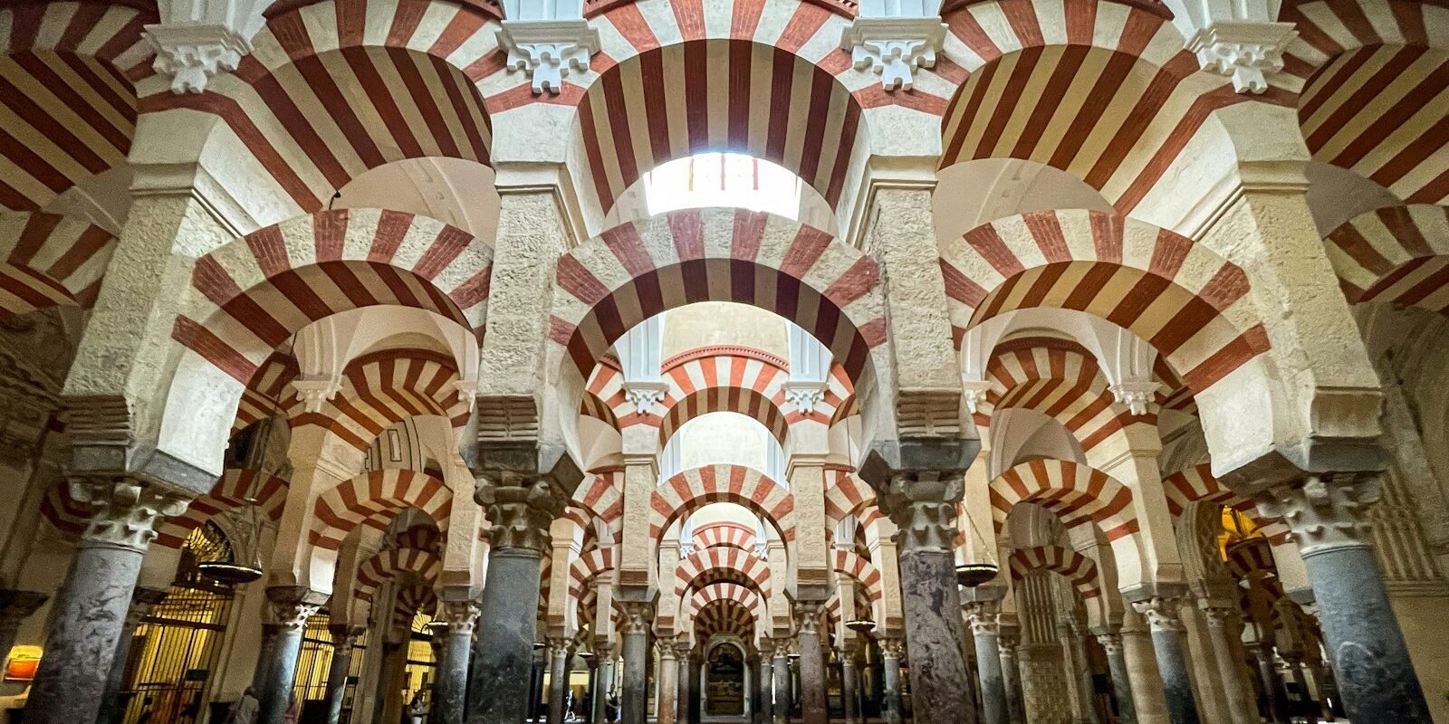 Red-and-white arches inside the Mezquita of Córdoba