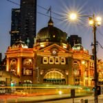 Flinders Street Station lit up at night in Melbourne