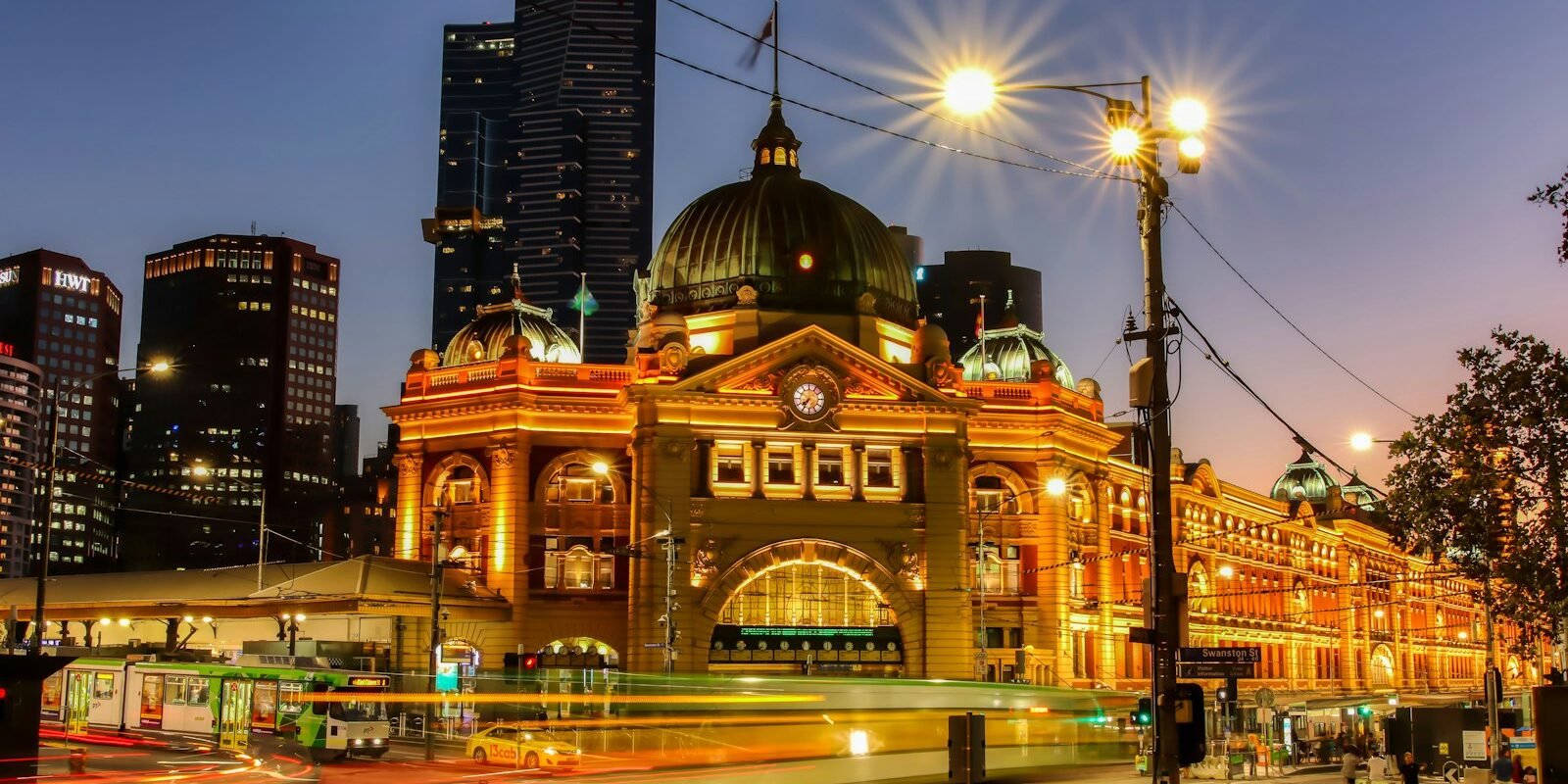 Flinders Street Station lit up at night in Melbourne