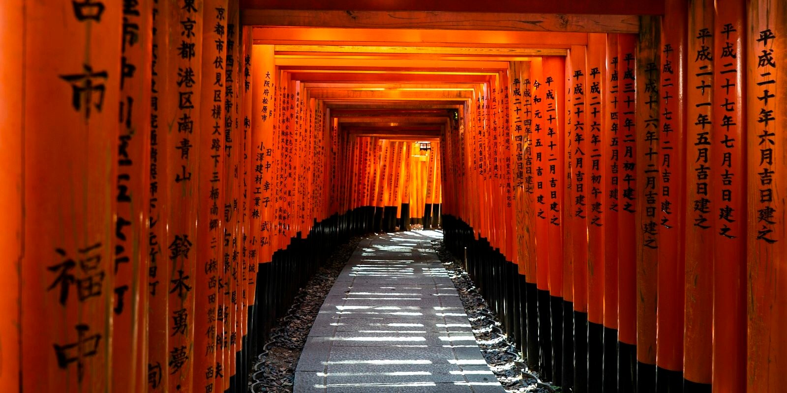 A tunnel of red torii gates at Fushimi Inari Taisha