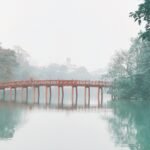 The red Huc Bridge on Hoan Kiem Lake, Hanoi