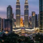 Petronas Twin Towers lit up at night in Kuala Lumpur