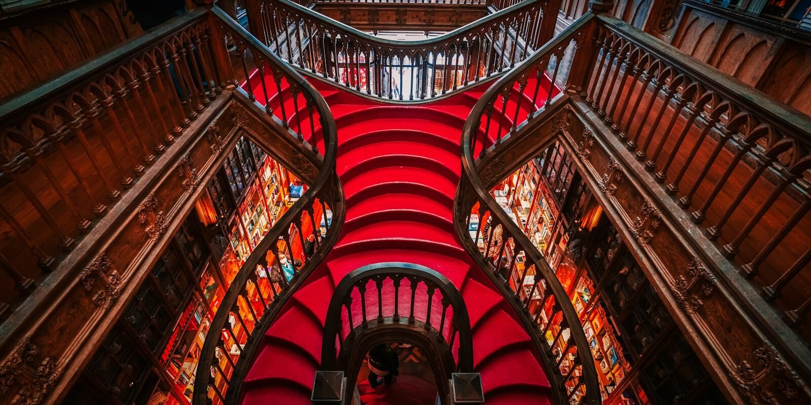 Red staircase inside Livraria Lello in Porto