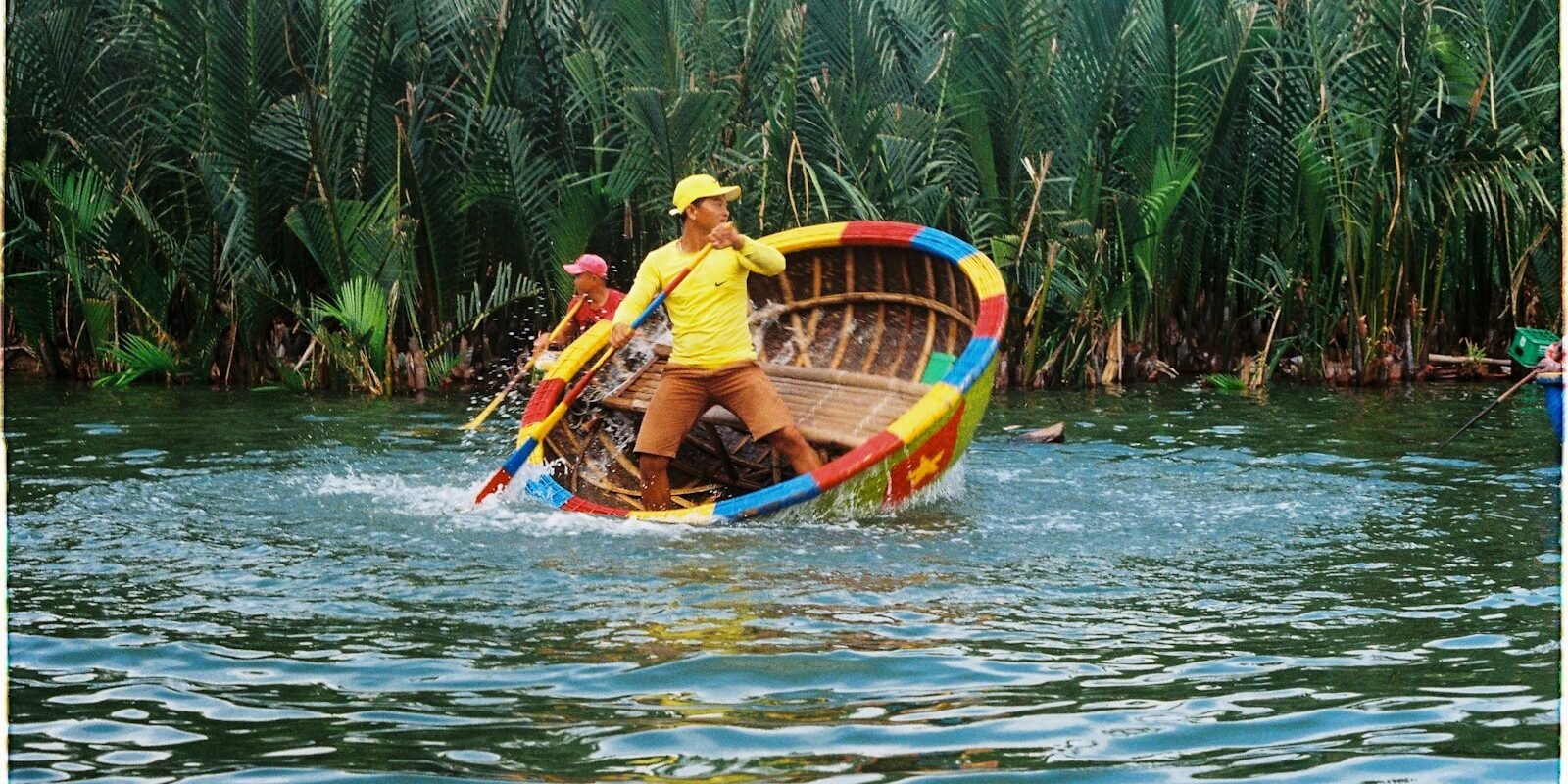 Boat on a palm-lined river near Hoi An