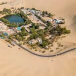 Huacachina oasis surrounded by sand dunes