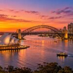 Sydney Harbour at sunset with the Opera House and Harbour Bridge