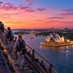 Climbers on the arch of the Sydney Harbour Bridge at twilight
