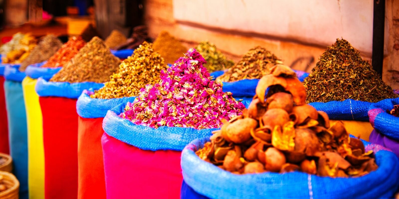 Colourful spices and dried flowers in a Marrakech souk