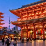 Sensō-ji temple and pagoda in Asakusa, Tokyo, with red lanterns and cherry blossoms