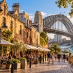 A historic laneway in The Rocks with the Sydney Harbour Bridge behind